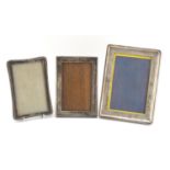 Three rectangular silver easel photo frames, various Birmingham hallmarks, the largest 20cm high x