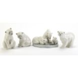 Four Lladro polar bears including a group of three, the largest 12.5cm high :For Further Condition