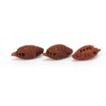 Three Chinese carved coquilla nuts, each approximately 4cm in length :For Further Condition
