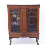 Mahogany breakfront bookcase fitted with a pair of glazed doors, raised on ball and claw feet, 133cm