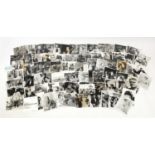 Collection of black and white film photographs, some with stamps to the reverse, the largest 25.