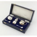 Silver three piece cruet with blue glass liners by J B Chatterley & Sons Ltd, Birmingham 1990,