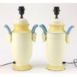 Pair of classical style painted porcelain table lamps with grotesque twin handles, each 47cm high :