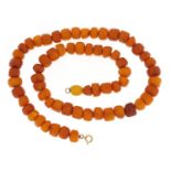 Butterscotch amber coloured bead necklace, 60cm in length, 65.0g :For Further Condition Reports