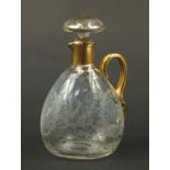 Continental glass decanter with gilt handle etched with a stag, buildings and flowers, 22.5cm