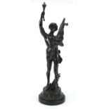 Large patinated bronze study of a young semi-nude male holding a bag and torch, 63.5cm high :For