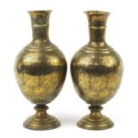 Large pair of Indian brass vases engraved with figures, animals and flowers, each 53cm high :For