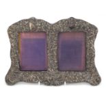 Edward VII silver double easel photo frame embossed with Putti amongst foliage, hallmarked