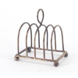 George VI silver four slice toast rack, indistinct makers mark, Birmingham 1938, 8cm wide, 61.2g :