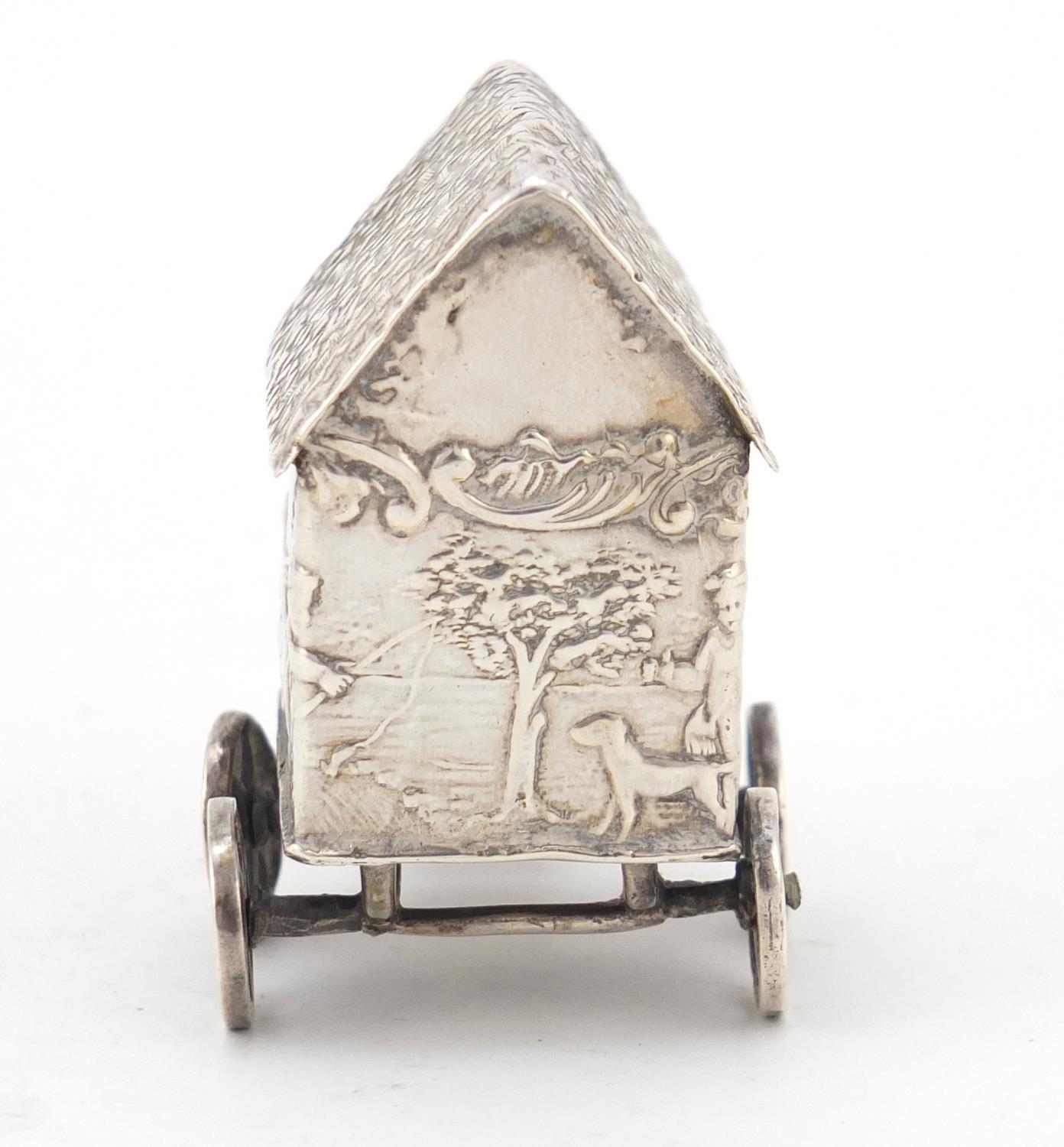 Victorian silver model of a young figure on a wagon, embossed with Putti playing, indistinct - Image 4 of 8