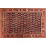 Rectangular Persian Afshar rug having an all over repeat design onto a red ground, 177cm x 118cn :