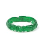 Chinese green jade bangle carved with a dragon, 7.5cm in diameter :For Further Condition Reports