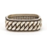 Chinese silver coloured metal rope twist design bangle, impressed character marks to the inside, 7.
