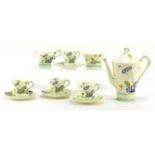 Art Deco tea ware decorated with flowers by Tuscan, including a coffee pot and four cups with