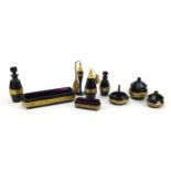 Moser amethyst glass vanity items with gilt foliate banding including atomisers, scent bottles and