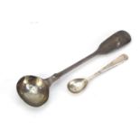 Two silver spoons including a Georgian mustard example, the largest 10.5cm in length, 10.4g :For