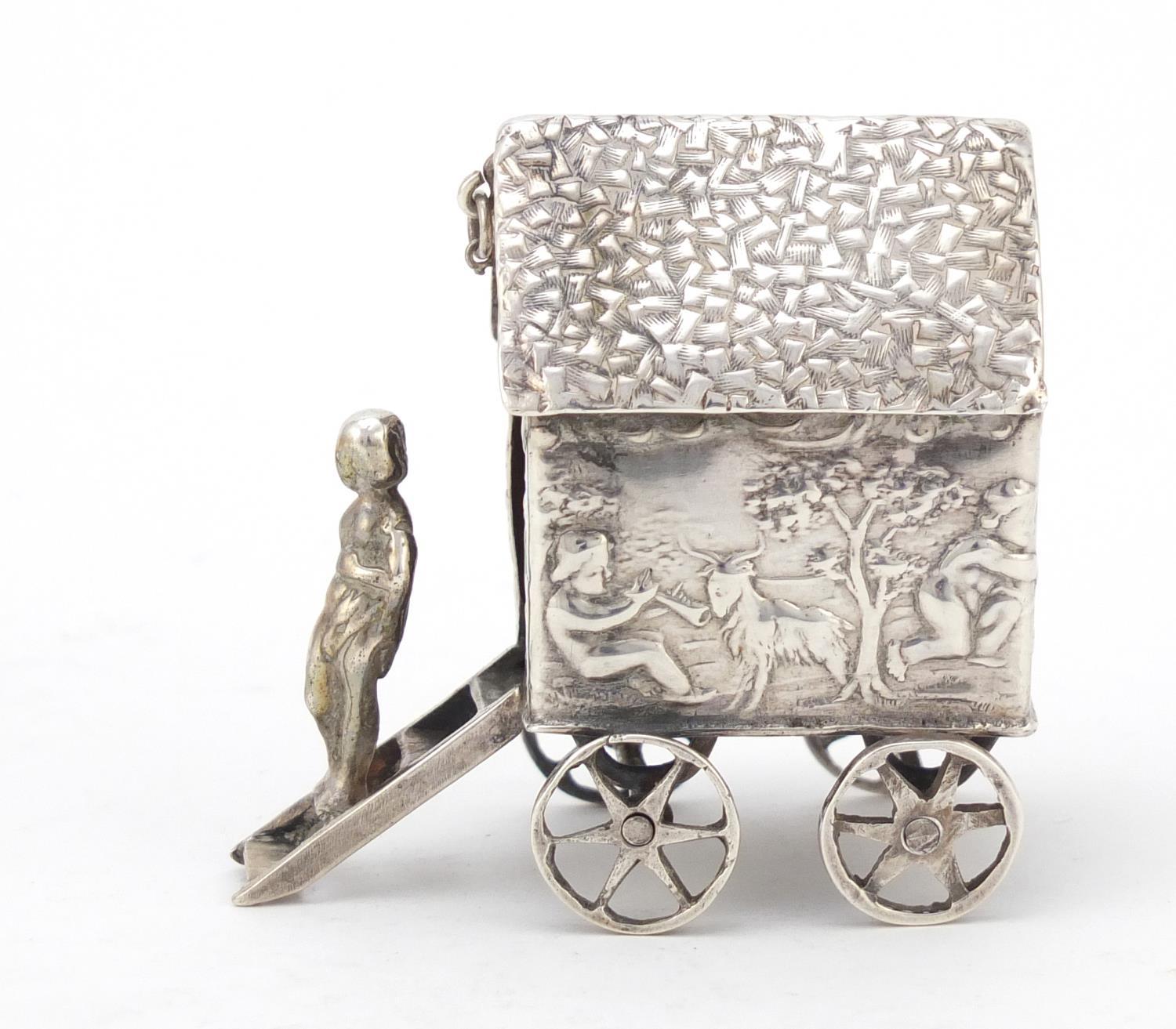 Victorian silver model of a young figure on a wagon, embossed with Putti playing, indistinct - Image 3 of 8