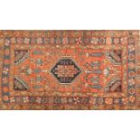 Rectangular Persian rug with central medallion, having an all over floral design onto a