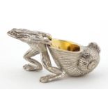 Novelty silver plated salt with gilt interior in the form of a frog pulling a snail shell, 10cm in