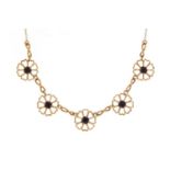 9ct gold and garnet flower head design necklace, 40cm in length, 4.7g :For Further Condition Reports