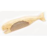 Scrimshaw style carved bone comb in the form of a whale, 11cm in length :For Further Condition