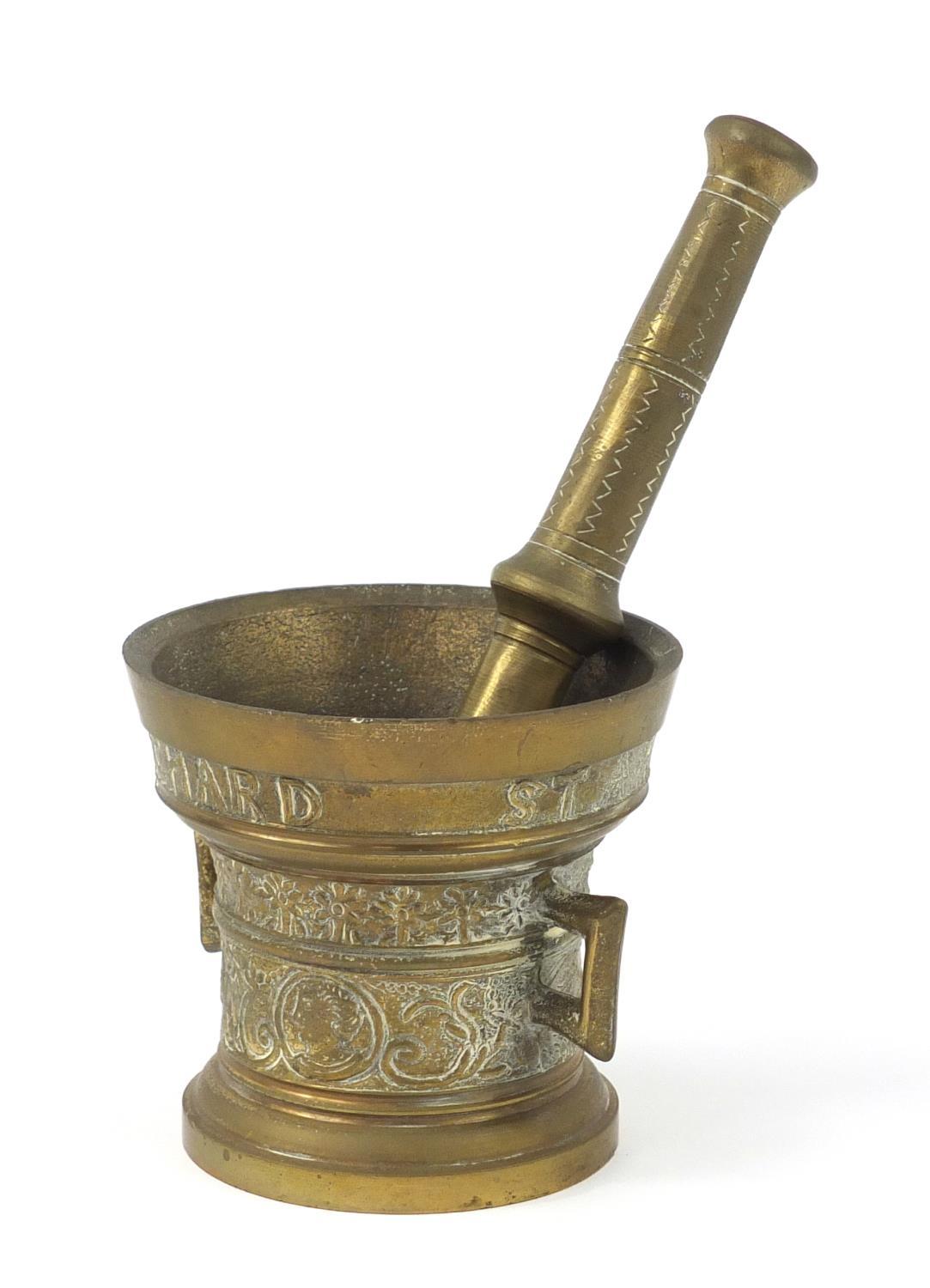 17th century style brass pestle and mortar, decorated with figures and flowers, the mortar 12cm high