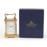 Garrard & Co brass cased carriage clock with enamelled dial having Roman numerals and box, 12cm high