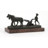 Patinated bronze group of two work horses raised on a rectangular marble base, 22.5cm wide :For