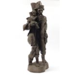 Floor standing wood carving of an elderly man with a dog holding a baby and a staff, 103cm high :For