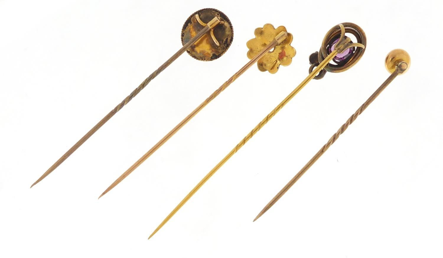 Four Victorian unmarked gold and gilt metal tie pins including a serpent and one set with a - Image 3 of 3