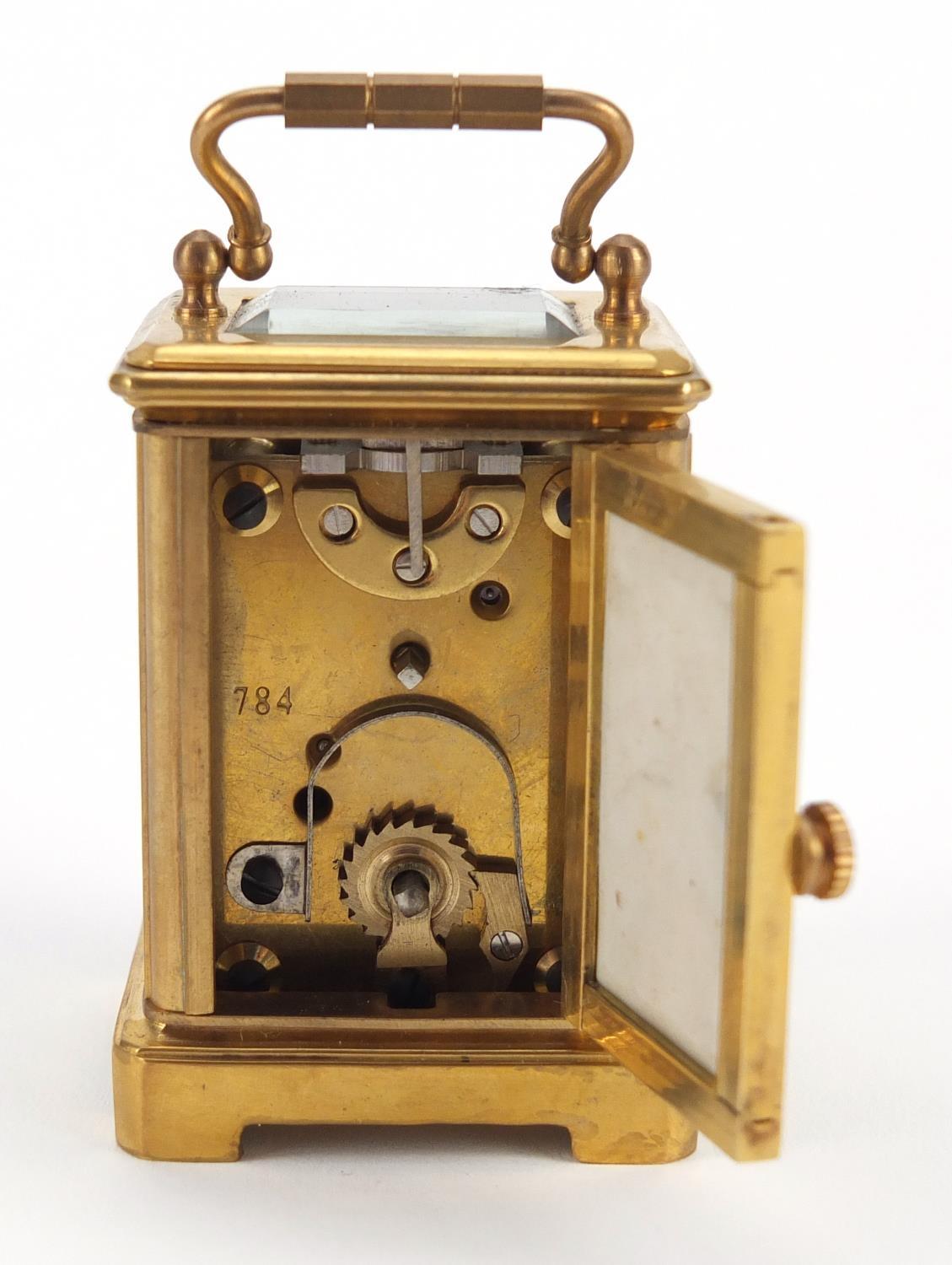 Miniature brass cased carriage clock with porcelain panels, hand painted and gilded with flowers, - Image 5 of 8