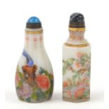 Two Chinese glass snuff bottles hand painted with birds amongst flowers, the largest 9.5cm high :For