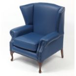 Contemporary wingback armchair with blue leather button upholstery, 103cm high :For Further