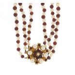 Three row garnet and pearl necklace with 9ct gold clasp, DHJ maker's mark, housed in a JB Yabsley