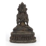 Chino-Tibetan patinated bronze figure of seated Buddha, 19cm high :For Further Condition Reports
