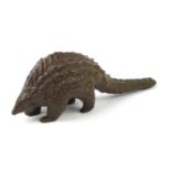 Japanese patinated bronze armadillo, impressed character marks to the base, 10.5cm in length :For