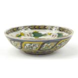 18th century Turkish Kutahya pottery bowl hand painted with fish and flowers, 16.5cm in diameter :