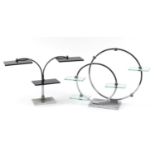 Two Art Deco chrome display stands with glass shelves, the largest 40cm high :For Further
