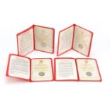 Four States of Jersey parish emblems one pound coins with wallets comprising 1984 St Savior, 1985 St