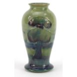 William Moorcroft pottery baluster vase hand painted in the Hazeldene pattern, 10cm high :For
