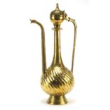 Islamic brass water pot with writhen body, 49.5cm high :For Further Condition Reports Please Visit