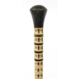 Whale vertebrae swagger stick with horn pommel and ferrule, 72cm in length :For Further Condition