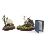 Two Border Fine Art animal sculptures with wood bases, comprising First One In and Point of