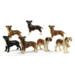Seven Coopercraft hand painted porcelain dogs, each approximately 20cm in length :For Further