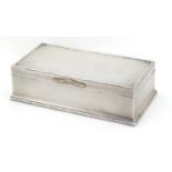 George V rectangular silver cigar box with hinged lid and engine turned decoration, by Adie Brothers