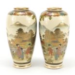 Pair of Japanese Satsuma pottery vases hand painted with figures in landscapes, character marks to