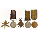 British military World War I four medal group with Machine Gun Corps cap badge comprising George V