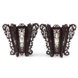 Pair of Chinese carved wood wall lights with panels, each decorated with birds, 33cm high :For