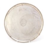 George III circular silver three footed salver, by Richard Rugg II, London 1781, 25.5cm in diameter,