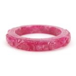 Chinese pink jade bangle carved with water dragons, 8.5cm in diameter :For Further Condition Reports
